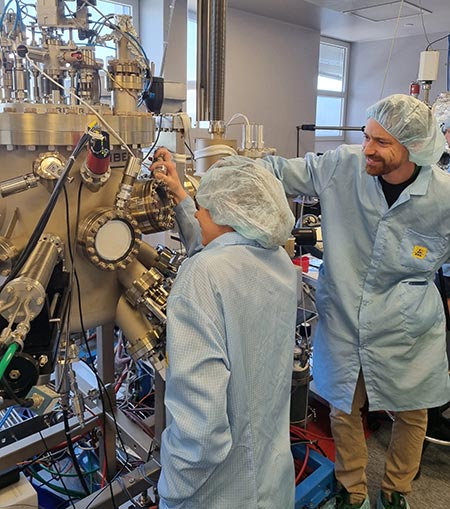 Catherine and Will enjoy the laboratory work associated with investigating quantum materials. Here they are making adjustments on the ultra-high vaccuum chamber in which they make their magnetic sandwiches.